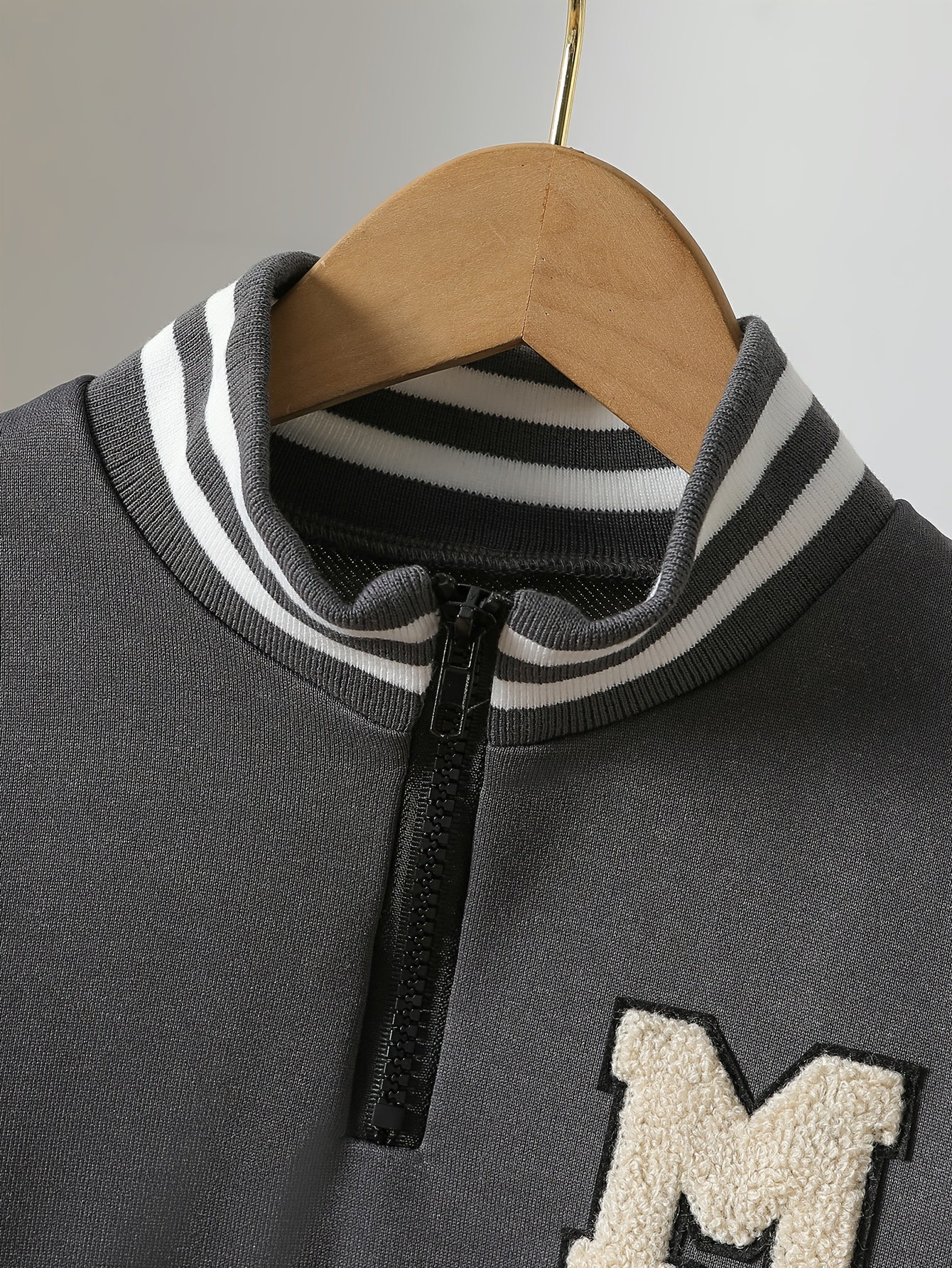 Boys' Autumn and Winter College Style Sports 2pcs Set! Dark Gray Hoodie with Contrast White Sleeves, High Neck Striped Ribbed Detail, Matching Solid Color Drawstring Pants. Fabric is Durable and Wrinkle-Resistant, Light Beige